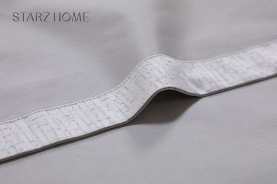 Un ensemble de draps de lit moderne et simple 100% coton pour toute saison