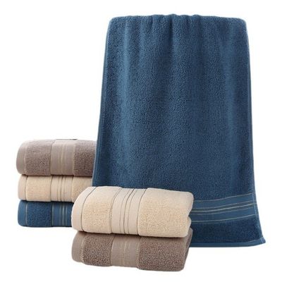 Une serviette ménagère dorée lavable en coton à 100% pour un séchage rapide et une absorption