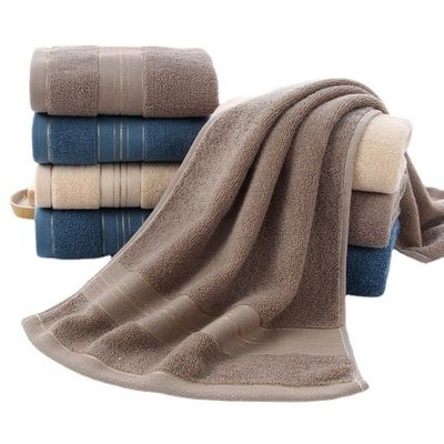 Une serviette ménagère dorée lavable en coton à 100% pour un séchage rapide et une absorption
