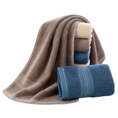 Une serviette ménagère dorée lavable en coton à 100% pour un séchage rapide et une absorption