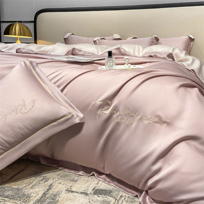 Couleur solide Lumière Luxe Broderie en soie lavée 4 pièces Lit ensemble avec feuille montée